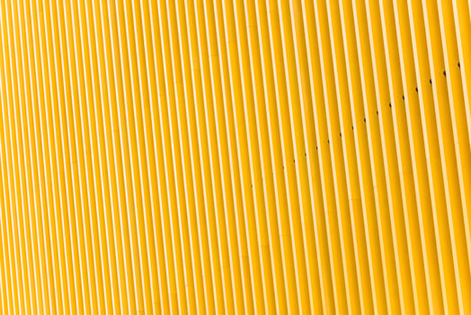 Detail of yellow metal building facade photo
