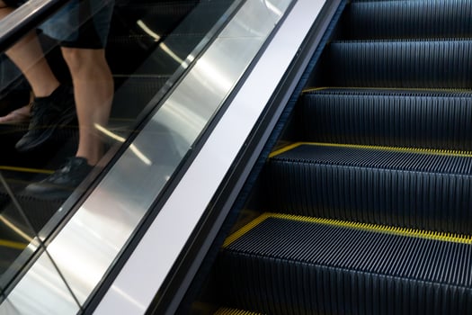Escalator in sunshade with selective focus. Natural light from outside photo