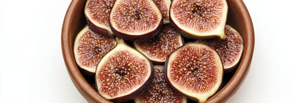 Ripe Fig fruit Halves in a Wooden bowl , Freshly sliced organic Figs, Healthy food concept photo