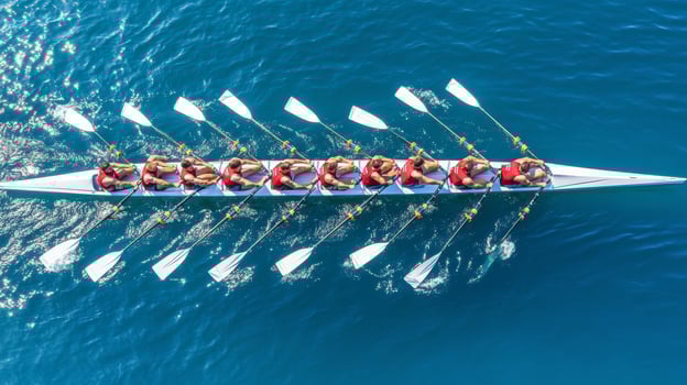 Synchronized Rowing Team in Red, Eight Rowers Powering Through Blue Water, Cooperation Concept photo