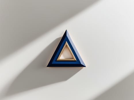 A blue triangle with gold on it photo