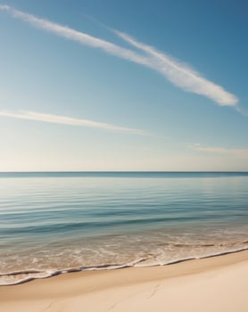 A beach with a blue sky and white sand photo