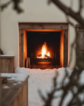A fire is burning in a fireplace in the snow photo