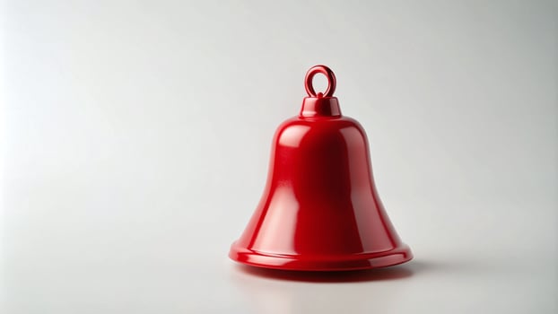 Single Red Christmas Bell on a Plain White Background photo