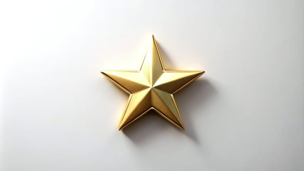 Gold Star Lying Flat on White Background photo