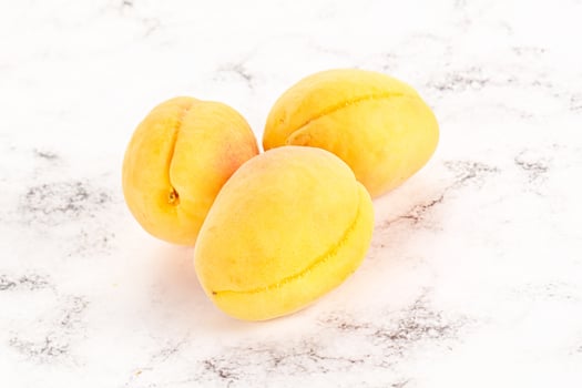 Ripe sweet juicy apricot heap photo