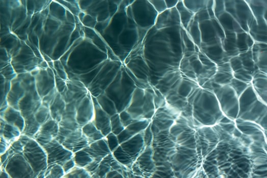Water surface with ripples and reflections photo