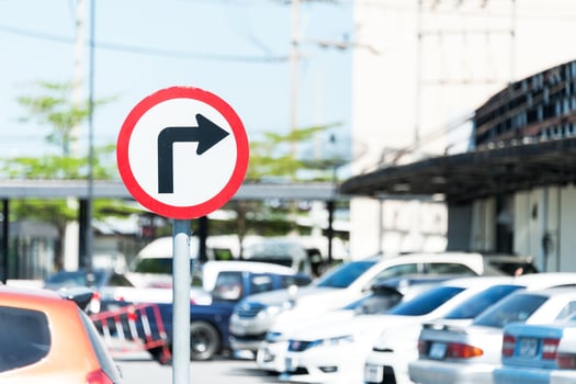 Turn sign in car parking sun light photo