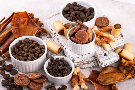Assortment of different dog treats and snack photo