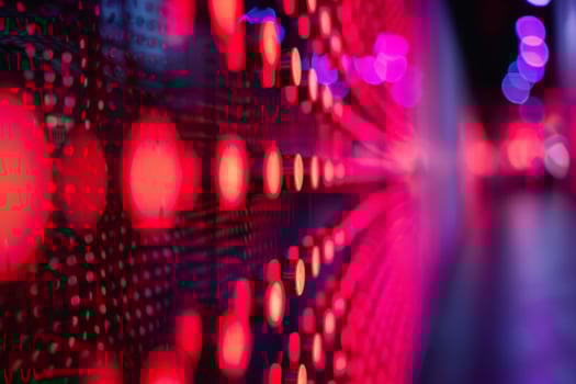Abstract photo featuring red and pink LED lights with a bokeh effect, ideal for modern and tech themes.