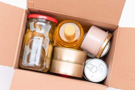 Food Reserves or Donation Box. Carton Box with Canned Food, Cereals and Grocery. Emergency Food Storage in Case of Crisis. Free Social Help, Blessings and Care. Strategic Food Supplies photo