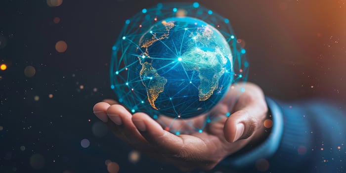 Hand holding digital Earth globe representing global connectivity and advanced networking technology. photo