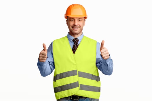 Positive Repairman Worker Gesturing Thumbs Up Standing Over White Studio Background. Great Repair Service Concept photo