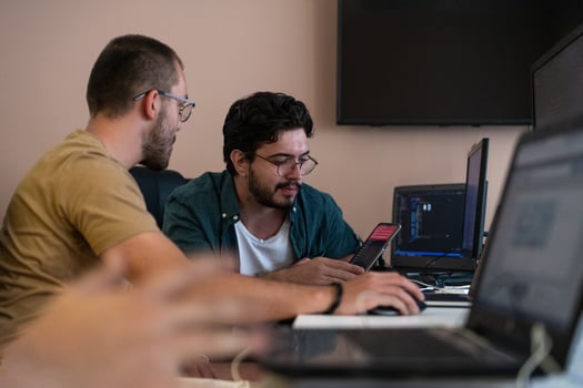 Collaborative Minds. A Team of Programmers Tackling Challenges Together in the Office. photo