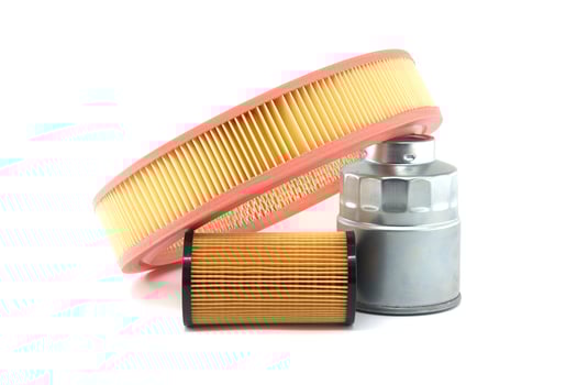 A collection of car engine filters, including air, oil, and fuel filters, isolated on white photo