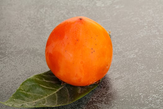 Fresh ripe sweet juicy persimmon photo