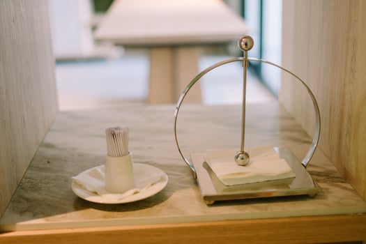 Luxurious hotel tissue holder elegantly displayed, featuring a stylish design and premium materials, photo