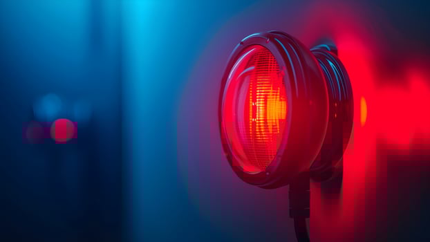 A red light is shining on a wall photo