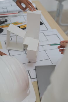 Construction and structure concept of Engineer or architect meeting for project working with partner and engineering tools on model building and blueprint in working site, contract for both companies. photo