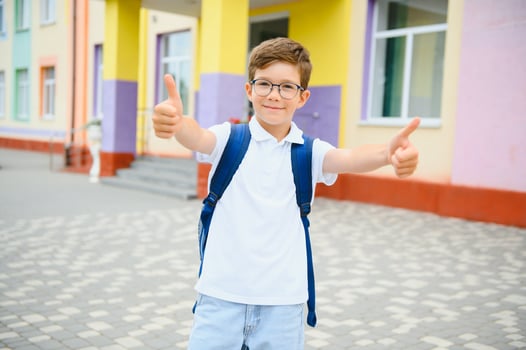 Child Riding Bicycle from School photo