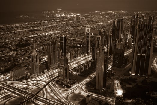 Dubai downtown night scene with city lights. Top view photo