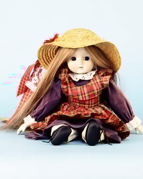 Charming Tartan-Dressed Doll with Fashionable Hat and Stylish Sleeves photo
