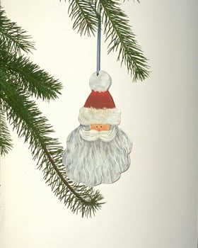 Festively Adorned Christmas Tree with Unique Ornaments and Evergreens photo