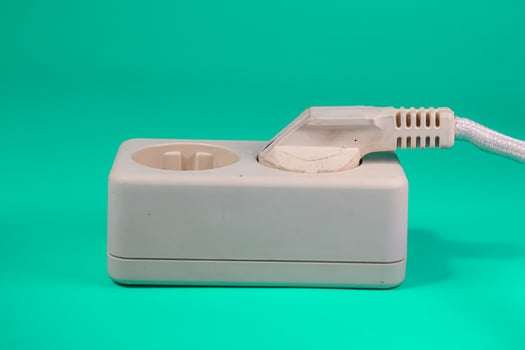 socket and plug isolated on green photo