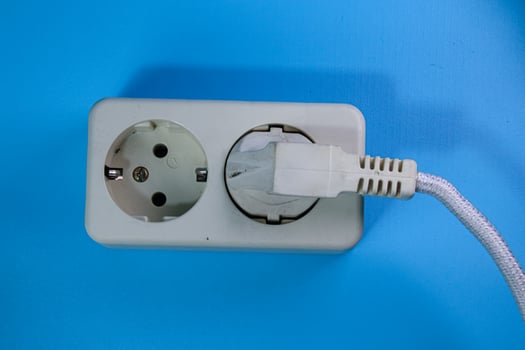 top view of white socket on blue background photo