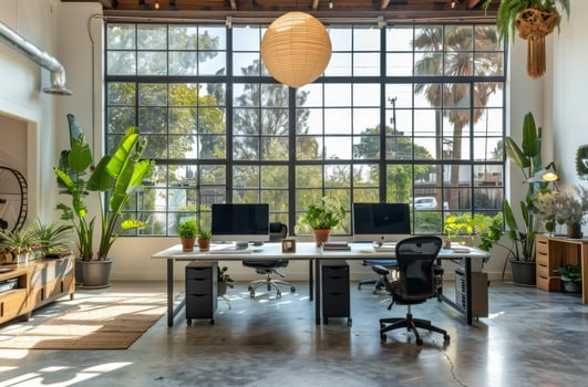 Modern Industrial Office Workspace With Natural Light and Greenery photo