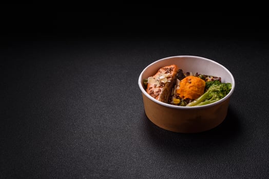 Grilled salmon with salt and spices, broccoli, tomatoes, rice photo