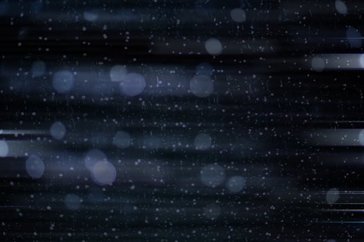 Abstract background of blurred motion drop light on the dark background. Spark a horizontal line of light. photo