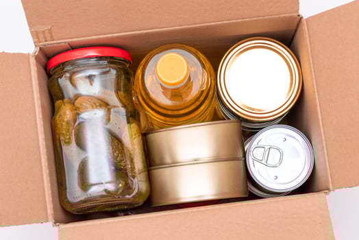 Food Reserves or Donation Box. Carton Box with Canned Food, Cereals and Grocery. Emergency Food Storage in Case of Crisis. Free Social Help, Blessings and Care. Strategic Food Supplies photo