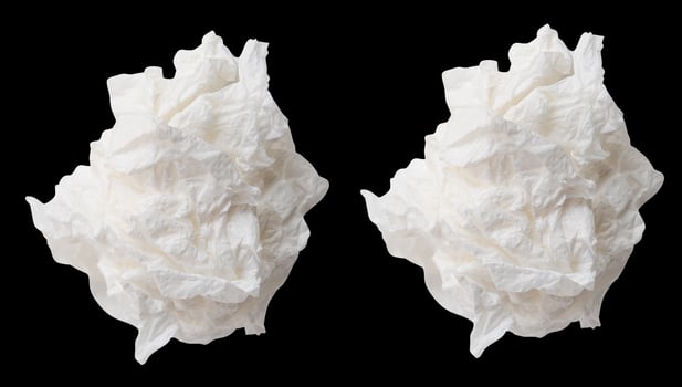 Top view set of screwed or crumpled white tissue paper ball isolated on black background with clipping path photo