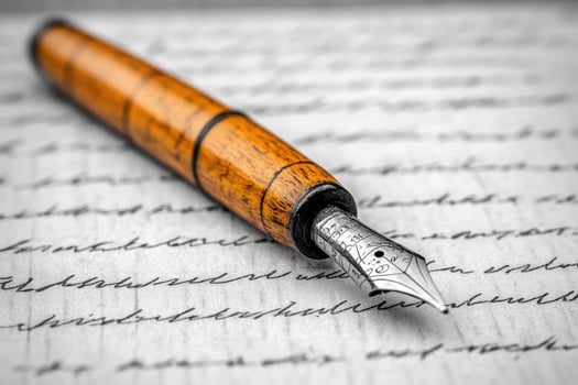 Elegant fountain pen resting on handwritten letter evoking nostalgia and timeless writing photo