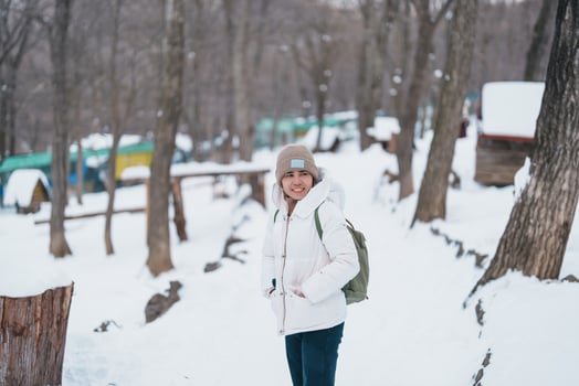 Woman tourist with Cute fox on snow in winter season at Zao fox village, traveler sightseeing Miyagi prefecture. landmark and popular for attraction near Sendai, Tohoku, Japan. Travel and Vacation photo