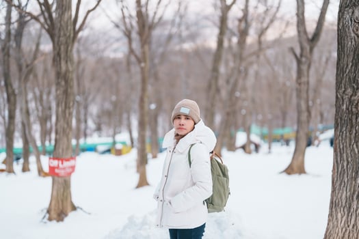 Woman tourist with snow in winter season at Zao fox village, traveler sightseeing Miyagi prefecture. landmark and popular for attraction near Sendai, Tohoku, Japan. Travel and Vacation photo