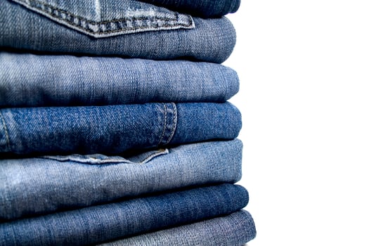 stack of blue jeans photo