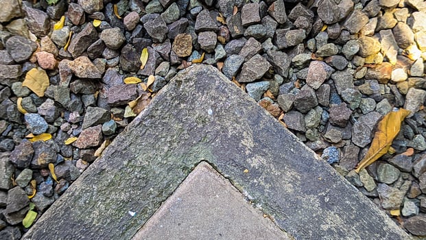 Close-Up of Gravel and Concrete Corner photo
