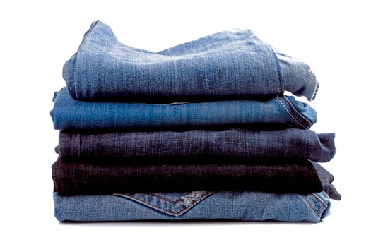 stack of blue jeans photo