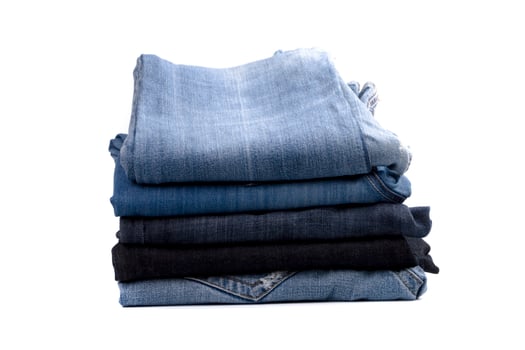 stack of blue jeans photo
