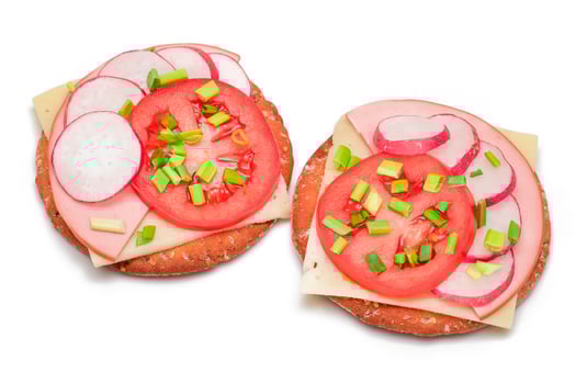 Crispy Cracker Sandwiches with Tomato, Sausage, Cheese, Green Onions and Radish - Isolated on White. Easy Breakfast. Diet Food. Quick and Healthy Sandwiches. Crispbread with Tasty Filling - Isolation photo
