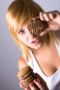 woman eating chocolate chip cookies photo