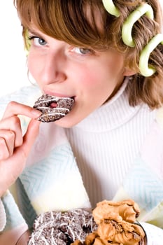 woman eating chocolate chip cookies photo