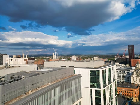 Iconic Buildings at Central Greater Manchester City Centre and Tall Buildings During Golden Hour of Sunset over England UK. Aerial Footage Was Captured with Drone's Camera on May 5th, 2024. photo