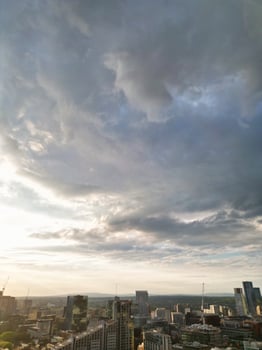 Iconic Buildings at Central Greater Manchester City Centre and Tall Buildings During Golden Hour of Sunset over England UK. Aerial Footage Was Captured with Drone's Camera on May 5th, 2024. photo