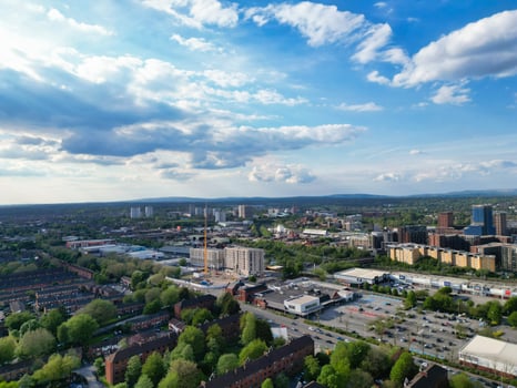 Iconic Buildings at Central Greater Manchester City Centre and Tall Buildings During Golden Hour of Sunset over England UK. Aerial Footage Was Captured with Drone's Camera on May 5th, 2024. photo