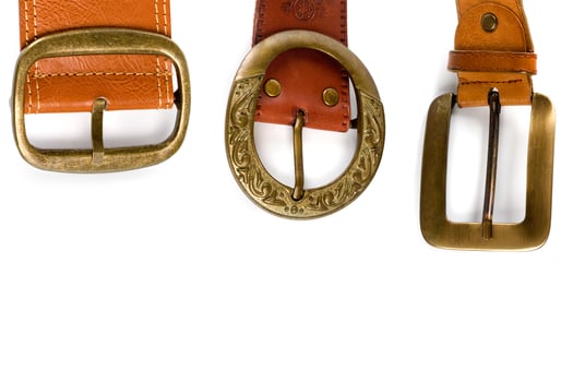 three brown leather belts photo