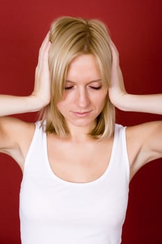 woman covering her ears photo