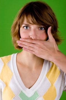 woman with silence gesture photo